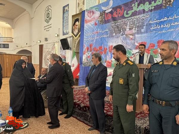 خانواده شهید «سیف الله اسدی مینا» تجلیل شد