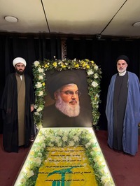 نفر سمت چپ حجت‌الاسلام محمدعلی معینیان